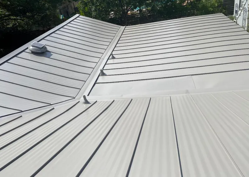 Solar attic fan installed on a metal roof for Roof Ventilation in Centralia